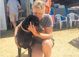  ??  ?? Carolyn Press-McKenzie — here with Keira, whose owner is fighting the fires — says when she heard the blaze was growing she knew she had to help.