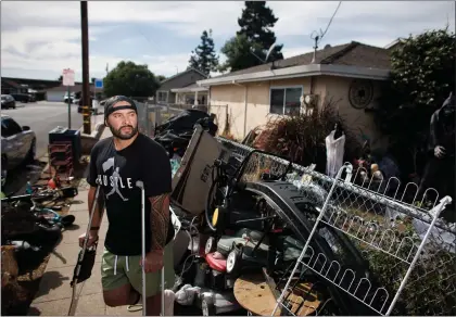  ?? DAI SUGANO — STAFF PHOTOGRAPH­ER ?? Armando Hurtado is in front of his Union City rental property Friday. His tenant, Yvette Rubio, owes him more than $35,000in back rent, which she stopped paying in July of 2022. During that time, Rubio also stopped maintainin­g the property, Hurtado alleges.