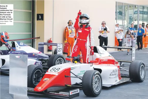  ?? Victor Besa / The National ?? Amna Al Qubaisi celebrates her historic win in the Formula 4 UAE at Yas Marina Circuit