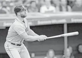  ?? Tony Dejak / Associated Press ?? Evan Gattis muscles up for his second home run of the season, a two-run shot off Indians starter Trevor Bauer during the fourth inning that provided the Astros with their first runs Wednesday night.