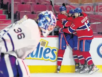  ?? ERIC BOLTE • USA TODAY SPORTS ?? Montreal Canadiens forward Jesperi Kotkaniemi (15) reacts with teammates after scoring the winning goal against Toronto Maple Leafs goalie Jack Campbell during the overtime period in Game 6 of the first round of the 2021 Stanley Cup Playoffs at the Bell Centre on Saturday night.