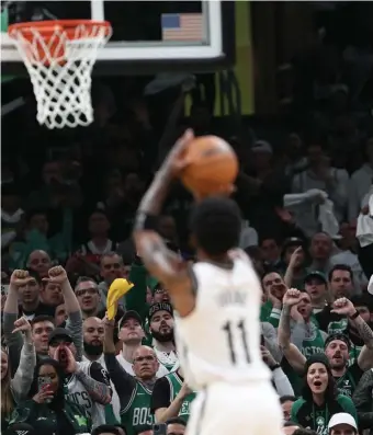  ?? NAncy lAnE pHOTOS / HErAld STAFF ?? HEARING IT: The TD Garden crowd gives it to Kyrie Irving while shooting a free throw during the third quarter of yesterday’s Celtics’ win.