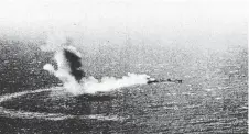  ??  ?? The USS Neosho ablaze in the Coral Sea.