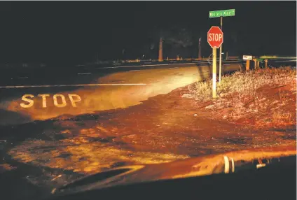  ?? Photos by Gabrielle Lurie / The Chronicle ?? A stop sign at Western Mine Road in Lake County, where Damin Pashilk is suspected of starting a fire — one of 17.