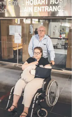  ??  ?? Jessica Allie, 34, of Mornington, waits for surgery at the Royal Hobart Hospital with her father, Steve. Picture: Eddie Safarik
