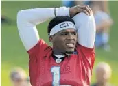  ?? CHUCK BURTON/AP ?? Panthers’ Cam Newton says his ability to run the ball is what makes him a productive quarterbac­k.