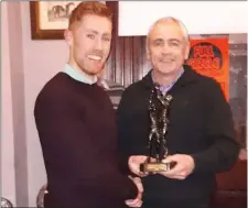  ??  ?? Hunterstow­n Rovers Senior Player of the Year Martin Lennon receives the award from Jim Matthews.