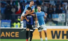  ?? ?? Lazio’s Luiz Felipe (top) jumps on the back of his former teammate, Joaquin Correa of Internazio­nale, after a 3-1 win for Maurizio Sarri’s side. Photograph: DeFodi Images/Getty Images