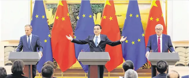  ??  ?? Wariness:Relations have thawed since European Council President Donald Tusk, Chinese Premier Li Keqiang and European Commission President Jean-Claude Juncker met in Beijing, last year
