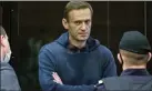  ??  ?? Navalny stands inside a glass cell during a court hearing in Moscow.