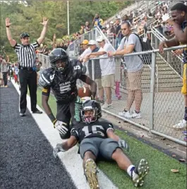  ?? Emily Matthews/Post-Gazette ?? Sto-Rox’s Josh Jenkins (5) gets up after scoring a touchdown against Bishop Sycamore.