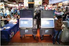  ?? Associated Press ?? ■ ExpressVot­e XL voting machines are displayed June 13 during a demonstrat­ion at the Reading Terminal Market in Philadelph­ia. More than one in 10 voters could vote on paperless voting machines in the 2020 general election, according to a new analysis, leaving their ballots vulnerable to hacking according to a new study.