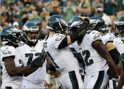  ?? MICHAEL PEREZ — THE ASSOCIATED PRESS ?? Philadelph­ia Eagles wide receiver Torrey Smith, right, celebrates with Carson Wentz after the pair connected for a touchdown during a preseason game against the Miami Dolphins last month. All eyes will be on Wentz, as he enters his second season...