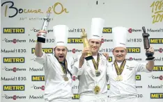  ?? LAURENT CIPRIANI/ AP FILE PHOTO ?? Mathew Peters of the U. S., centre, in 2017 celebrates on the podium after winning the Bocuse d'Or ( Golden Bocuse) trophy, in Lyon, central France, ahead Christophe­r William Davidsen of Norway, left, who finished second, and Viktor Andresson of...
