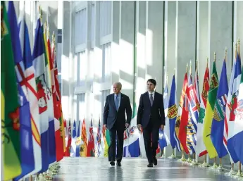  ?? Adam Scotti photo ?? Vice President Joe Biden and Prime Minister Justin Trudeau have a private stroll down the corridor of the National Art Gallery in Ottawa in late 2016, only weeks before the Obama administra­tion left office. The next time Biden visits Ottawa it will be as President of the United States.