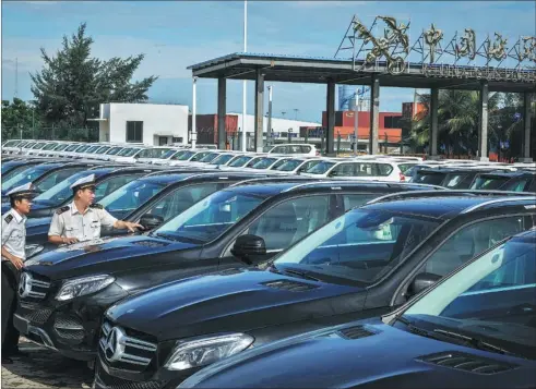  ?? PROVIDED TO CHINA DAILY ?? Vehicles await inspection at the import port of China Customs in Haikou, Hainan province.