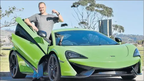  ?? Picture: IVOR MARKMAN ?? DREAM CAR: Kobus Fourie invitingly dangles the keys to the R4-million McLaren 570S which will shortly go up for sale along with a host of other high-end cars in the new Supreme Xotics showroom in Kabega