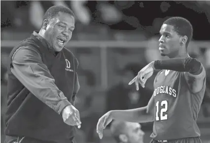  ??  ?? Michael James (right) is one of several valuable reserves for Douglass coach Greg Williams. The Red Devils play North Greene in the Class A semifinals on Friday. WADE PAYNE / FOR THE TENNESSEAN