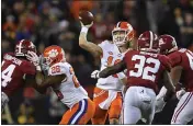  ?? JOSE CARLOS FAJARDO — BAY AREA NEWS GROUP, FILE ?? Clemson quarterbac­k Trevor Lawrence looks to pass against Alabama during the 2019Colleg­e Football Playoff National Championsh­ip at Levi’s Stadium in Santa Clara.