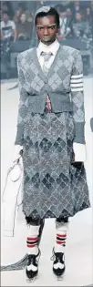  ?? JP Yim Getty Images ?? PATTERN vibrates in a design at the Thom Browne show.