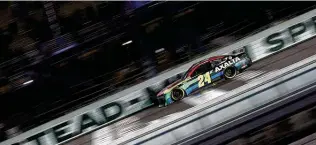  ?? Sean Gardner / Getty Images ?? William Byron, driving the No. 24 Axalta Chevrolet, crosses the finish line to win the Dixie Vodka 400 on Sunday at Homestead-miami Speedway. Byron’s first win came last August at Daytona.