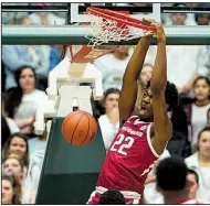  ?? AP/The Coloradoan/TIMOTHY HURST ?? Arkansas’ Gabe Osabuohien had five points and five rebounds off the bench in the Razorbacks’ victory over Colorado State on Wednesday night. The Hogs had a 38-7 edge in bench points.