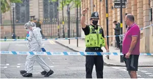  ??  ?? Forensics officers carry out a detailed search in Barwick Street, Birmingham