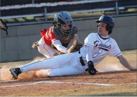  ?? Scott Herpst ?? LFO catcher Donnie Brown tags out Heritage’s Brady Chandler at the plate to prevent a run during last week’s game in Boynton. The Generals, however, rallied from a 5-0 first-inning deficit and beat the Warriors, 6-5.