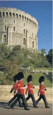  ?? ?? The Queens Guard patrols the grounds of the much-storied Windsor Castle, built in 1070.