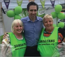  ??  ?? Dolly Canavan, Minister Simon Harris and Joyce Scallan at the East Coast Samaritans stand at the Tinahely Show.