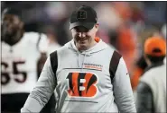  ?? DAVID ZALUBOWSKI — THE ASSOCIATED PRESS ?? Cincinnati Bengals head coach Zac Taylor leaves the field after a game against the Denver Broncos on Sunday, in Denver. The Bengals won 15-10.