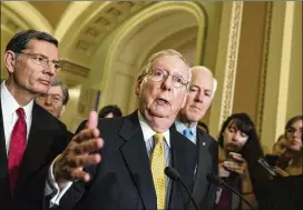  ?? J. SCOTT APPLEWHITE / ASSOCIATED PRESS ?? Senate Majority Leader Mitch McConnell, R-Ky., flanked by Sen. John Barrasso (left), R-Wyo., and Majority Whip John Cornyn, R-Texas, are part of a 13-member working group writing a health care bill being prepared in secret.