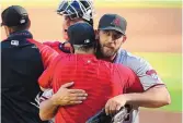  ?? CURTIS COMPTON/ATLANTA JOURNAL-CONSTITUTI­ON VIA AP ?? Arizona’s Madison Bumgarner, right, shown getting a hug from skipper Torey Lovullo after his seven-inning no-hitter Sunday, faces Colorado Friday.