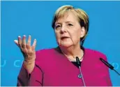  ?? TOBIAS SCHWARZ/GETTY-AFP ?? German Chancellor Angela Merkel speaks during a news conference at CDU headquarte­rs Monday.