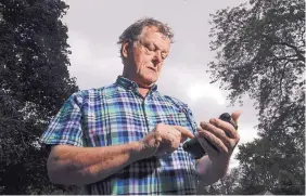  ?? ASSOCIATED PRESS ?? Towne & Country Building Inspection owner Scot McLean looks at his calendar outside his Fox Point, Wis., home on Wednesday. Towne & Country downloaded several apps to enhance the Google calendar the company uses for customer appointmen­ts. In July,...