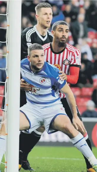  ??  ?? Lewis Grabban and keeper Robbin Ruiter get ready to defend a corner against Reading.