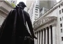  ??  ?? NEW YORK: In this Oct 2, 2014, file photo, the statue of George Washington on the steps of Federal Hall faces the facade of the New York Stock Exchange. —AP