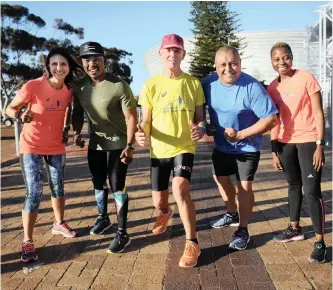  ?? | ARMAND
HOUGH/African News Agency (ANA) ?? Anthea Jacobs, Siyabulela Sokomani, Neal Stacey, Aden Thomas and Zamangoma Matlhare stand in front of Cape Town Stadium. Local runners are gearing up for the Cape Town Marathon taking place on Sunday, September 23. The race is Africa’s only IAAF gold label status marathon.