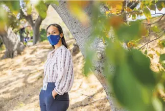  ?? Santiago Mejia / The Chronicle ?? Christine Molina of Oakland has continued to wear masks indoors all along, though she’s vaccinated, but she says the new guidance is “still a bummer.”