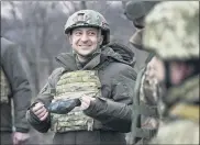  ?? ASSOCIATED PRESS FILE PHOTO ?? Ukrainian President Volodymyr Zelenskyy talks with servicemen as he visits the war-hit Donetsk region, eastern Ukraine.