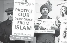  ??  ?? File photo shows members of the Australian Liberty Alliance (ALA) and supporters protesting outside the British consulate in support of jailed British right-wing activist and former leader to the English Defence League (EDL) Tommy Robinson, aka Stephen Christophe­r Yaxley-Lennon, in Melbourne. — AFP photo