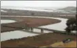  ?? ERIC RISBERG — THE ASSOCIATED PRESS FILE ?? Tidelands Trail goes through former salt ponds at the Don Edwards San Francisco Bay National Wildlife Refuge.