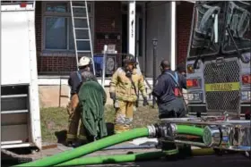  ?? MARIAN DENNIS – DIGITAL FIRST MEDIA ?? Fire department­s work to put out a fire on Beech Street Thursday afternoon. No injuries were reported in the blaze.