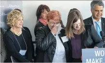  ?? SHAUGHN BUTTS ?? Debra Tomlinson of the Associatio­n of Alberta Sexual Assault Services, left, is embraced by Status of Women Minister Stephanie McLean as she announces new funding for Tomlinson’s organizati­on.