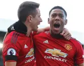  ??  ?? In form: Anthony Martial (right) celebrates his goal against Fulham