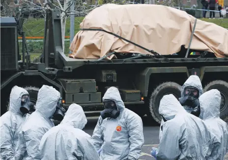  ?? Reuters ?? Soldiers remove vehicles from a car park in Salisbury on Sunday, a week after the nerve agent poisoning of the Skripals