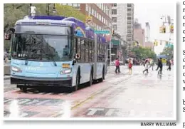  ?? BARRY WILLIAMS ?? An M14 bus zips down car-free 14th St., but business people say go slow on making new busways.