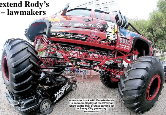  ?? KRIZJOHN ROSALES ?? A monster truck with Duterte decals is seen on display at the B2B Car Show at the Mall of Asia parking lot in Pasay City yesterday.
