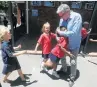  ??  ?? YAY, NO HOMEWORK! Sun Valley Primary School principal Gavin Keller with some of the pupils