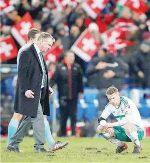  ??  ?? O’NEILL (kiri) jelas kecewa selepas gagal membantu Ireland Utara menempah tempat untuk beraksi pada Piala Dunia 2018 di St. Jakob-Park, Basel Ahad lepas.